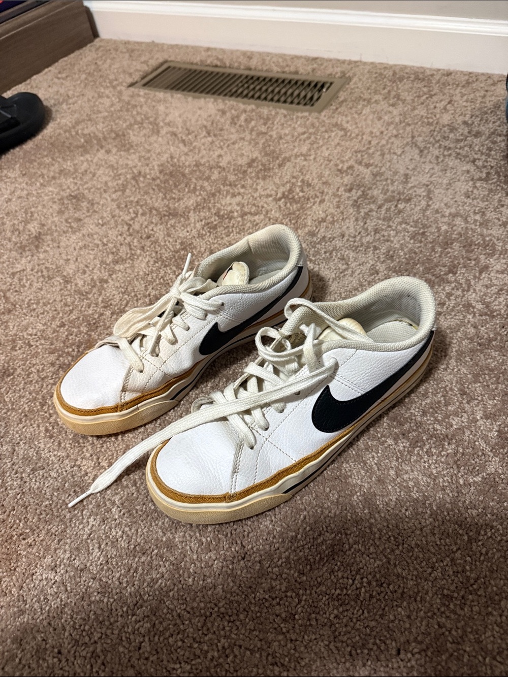 Nike White Low-Top Sneakers with Black Swoosh and Tan Trim